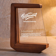 a wooden frame with a happy retirement plaque on it