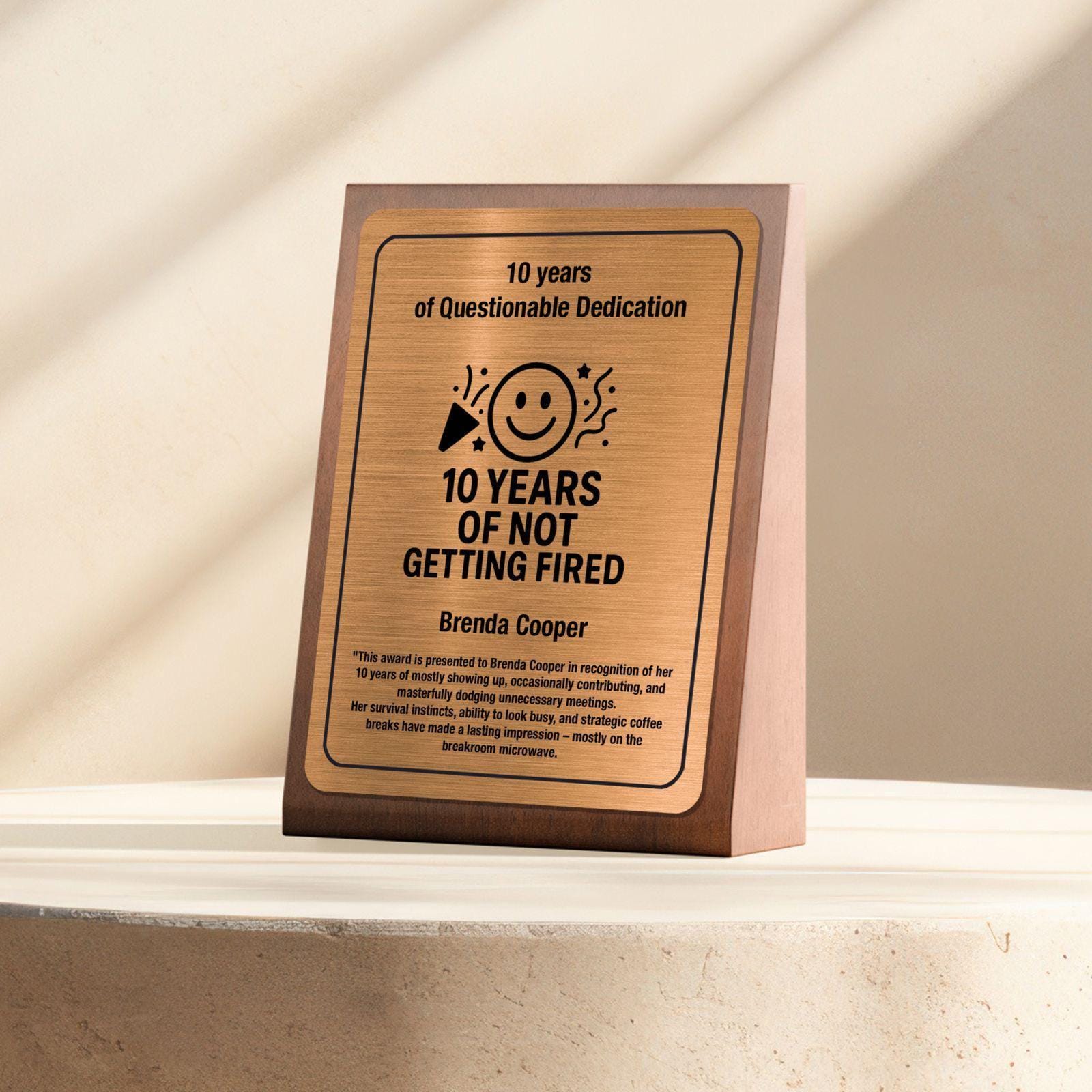 a plaque that says 10 years of not getting fired