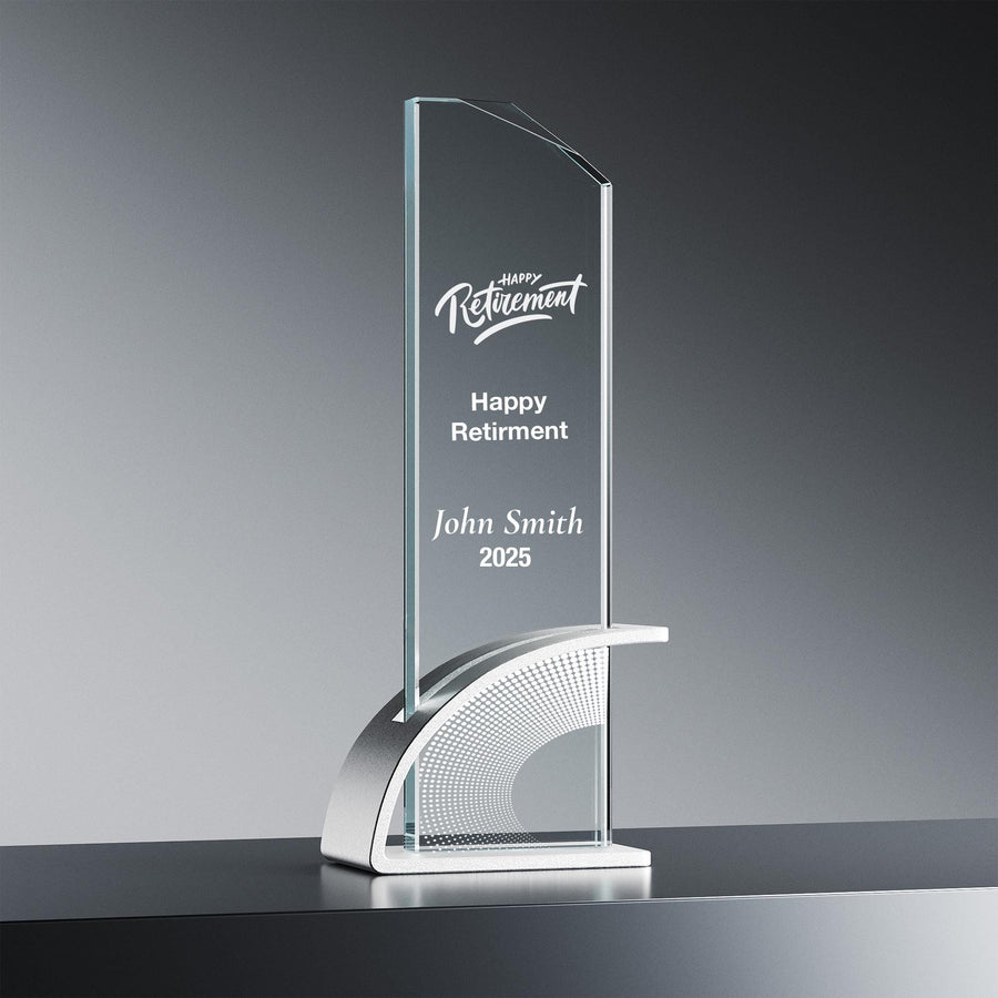 a clear glass trophy with a curved base