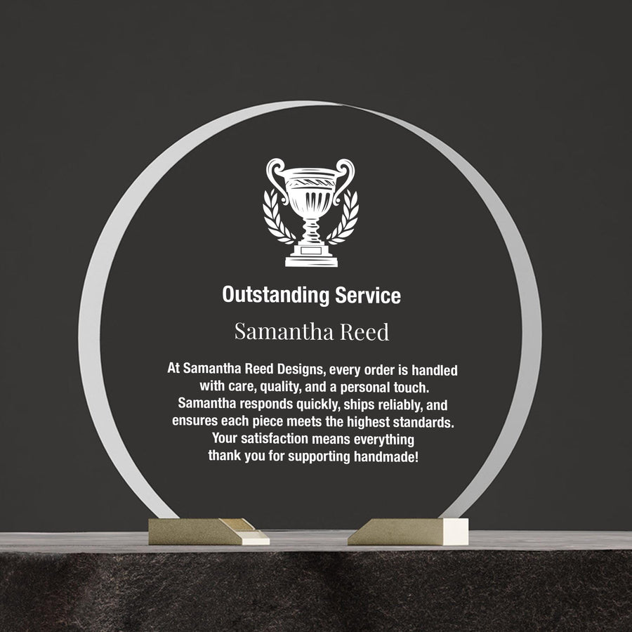 a plaque with a trophy on top of it