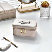 a white box sitting on top of a table next to a mirror