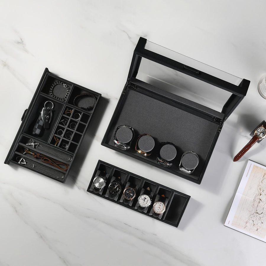 an assortment of watches and a pen on a table