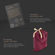a red bag with a gold ribbon and a greeting card