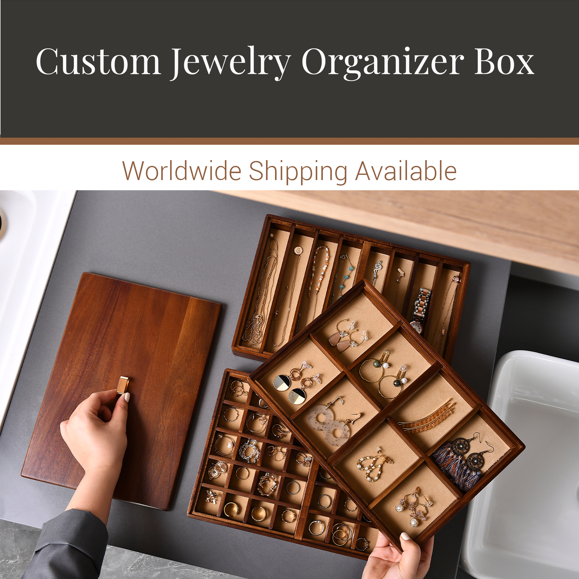 a person's hands holding a wooden jewelry organizer box filled with various pieces of jewelry, including earrings and necklaces.