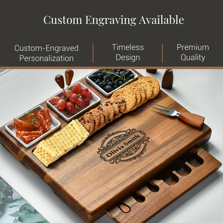 a wooden cutting board with a variety of food items, including grapes, cheese, crackers, and bread, arranged on it. The cutting board also has a knife and a fork placed on it. The image is accompanied by text that reads "Custom Engraving Available" and "Premium Quality", suggesting that the cutting board is available for custom engraving and is of high quality.