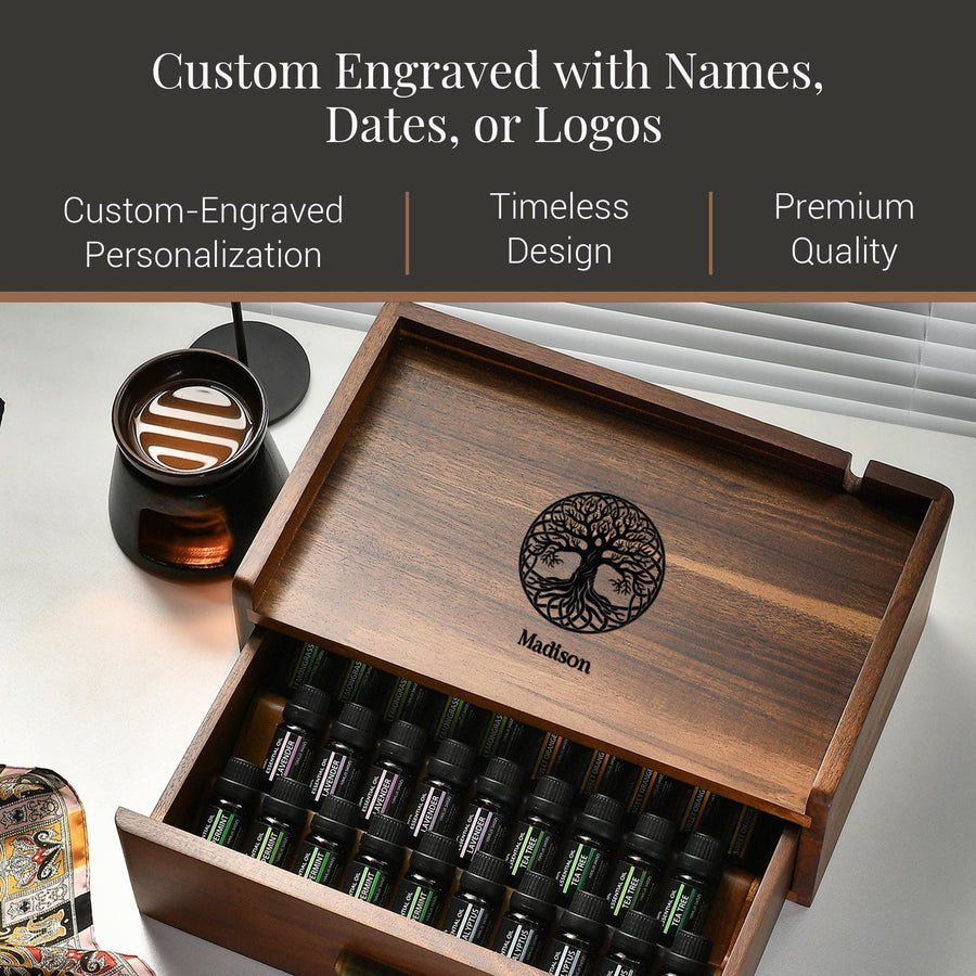 a wooden box with a tree design on it, containing various bottles of essential oils. The box is labeled "Madison" and has a "Premium Quality" inscription. The box is described as "Custom Engraved with Names, Dates, or Logos" and "Timeless Design".