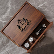 a wooden watch box with three watches in it