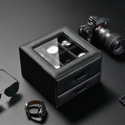 a pair of sunglasses sitting next to a black box