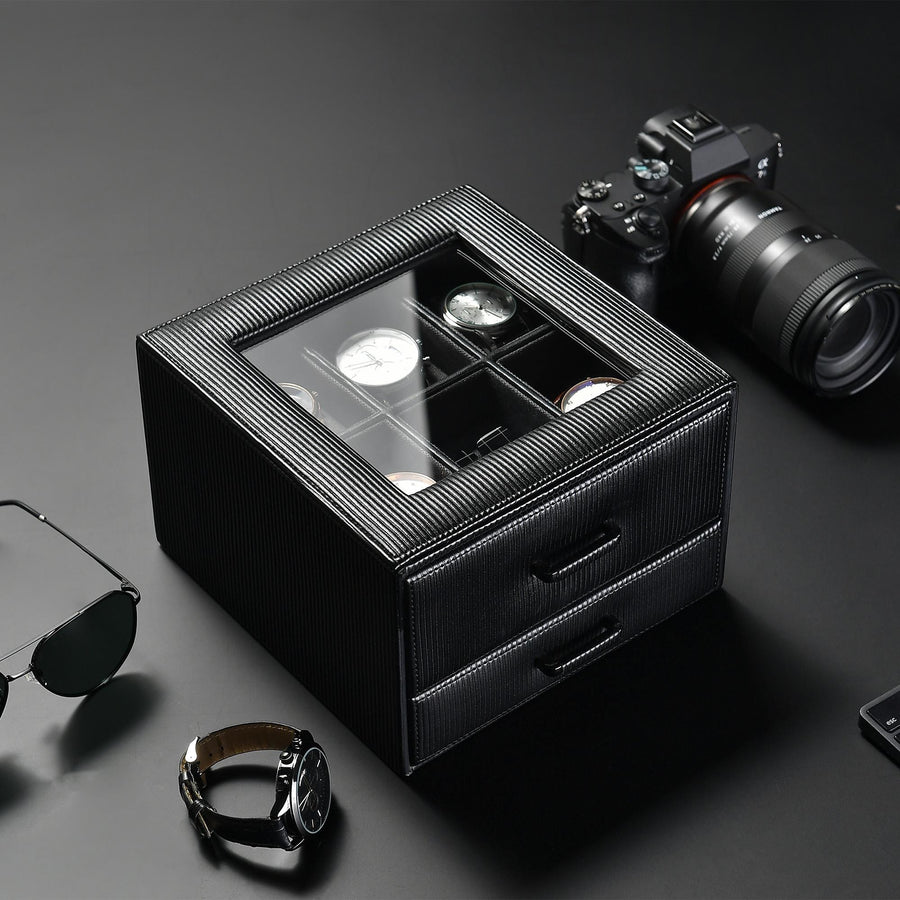 a pair of sunglasses sitting next to a black box