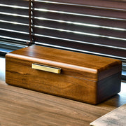 a wooden box sitting on top of a wooden table