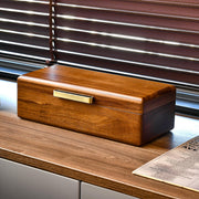 a wooden box sitting on top of a wooden desk