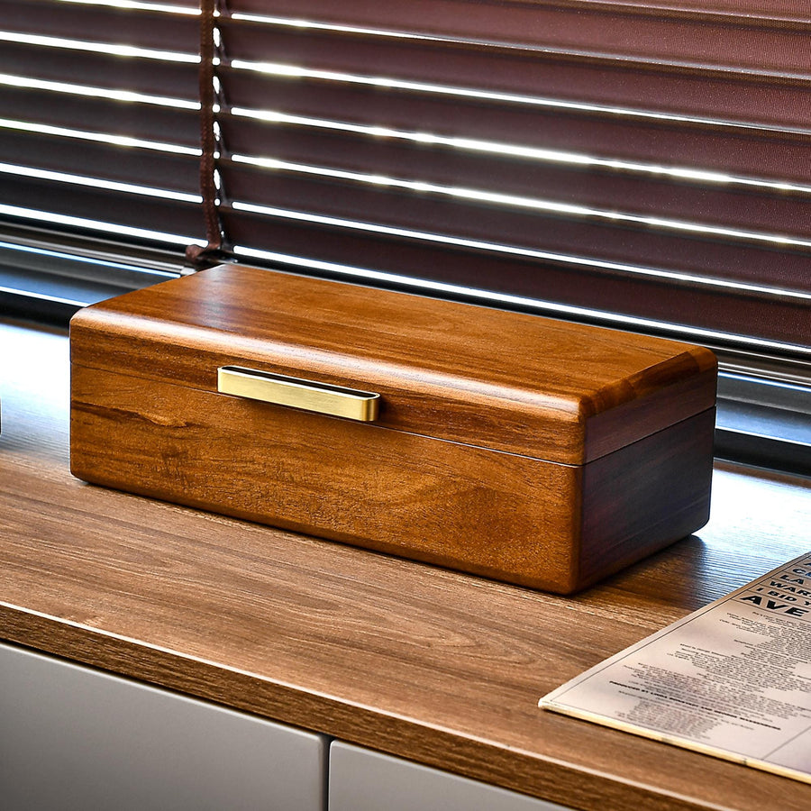 a wooden box sitting on top of a wooden desk