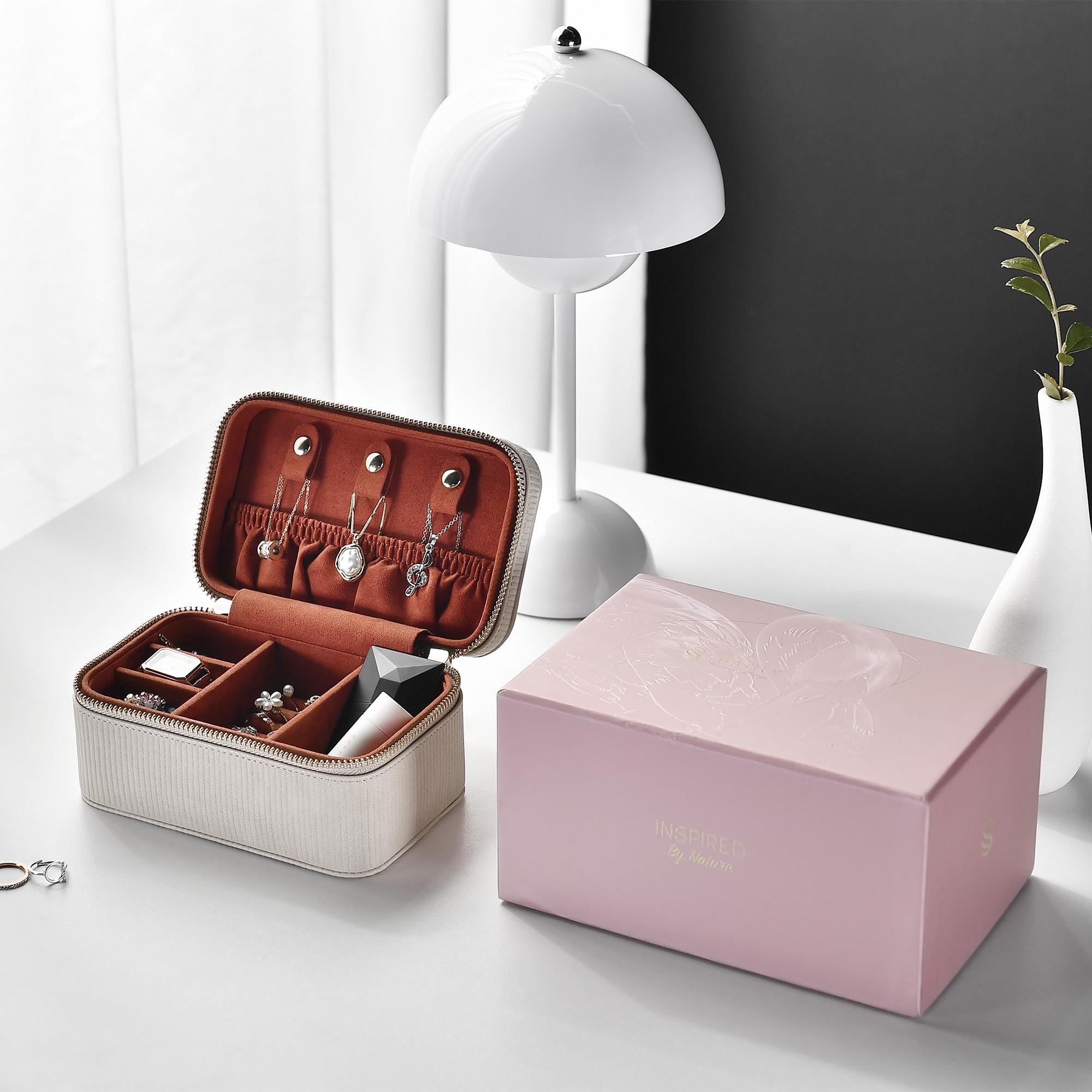a pink box with jewelry inside of it