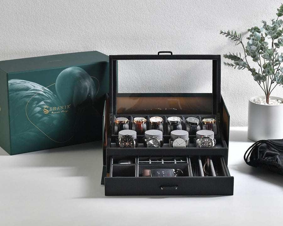 a box of watches sitting on a table next to a box of watches