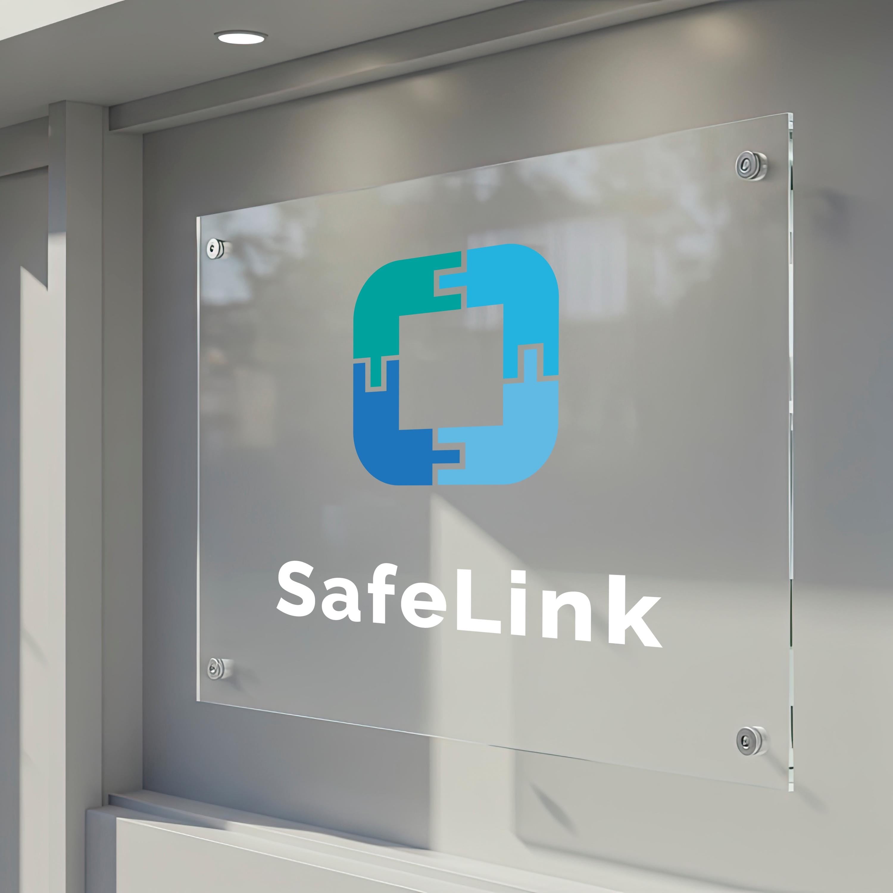 a clear glass sign with a logo and the text "SafeLink" displayed on it.