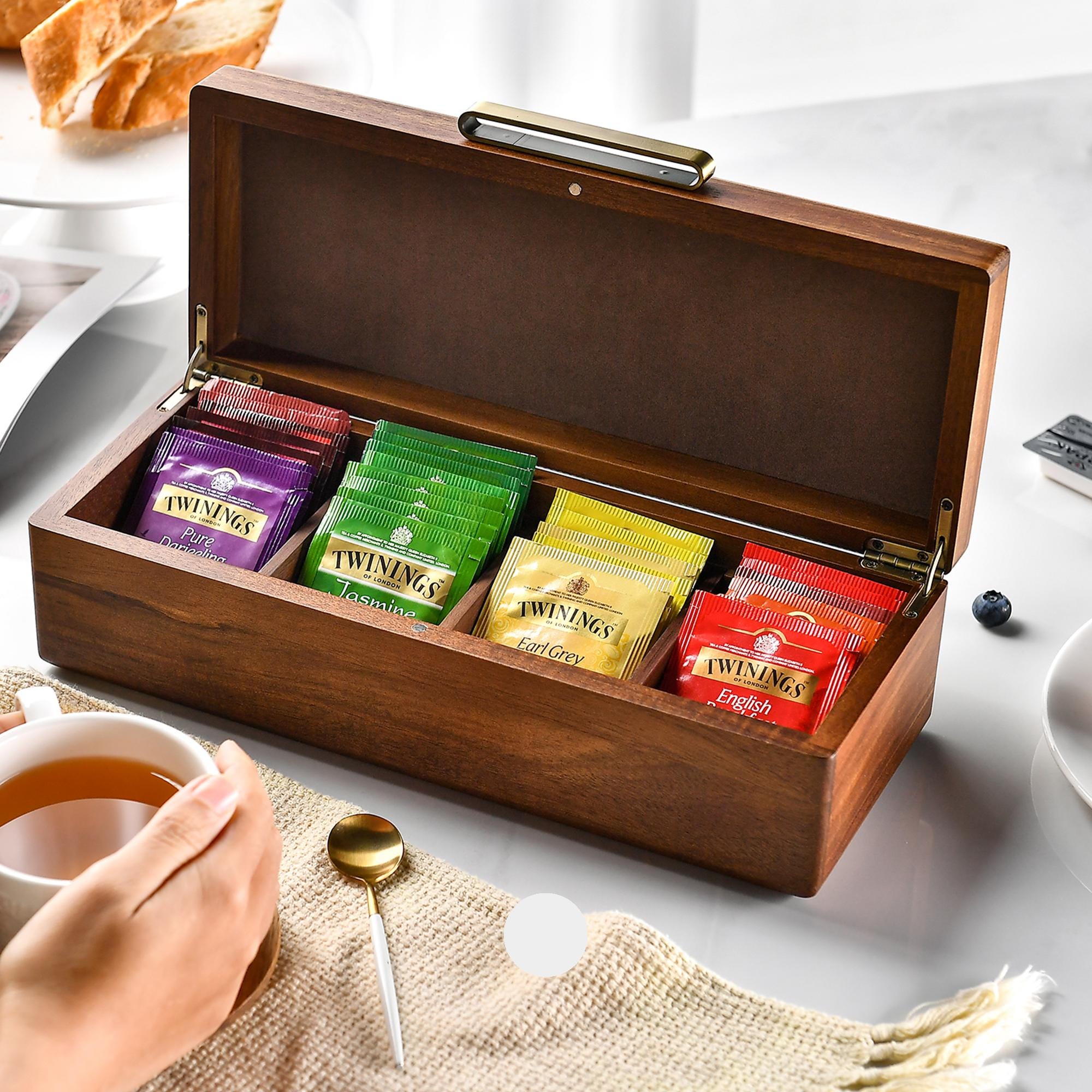 a wooden box filled with different types of tea
