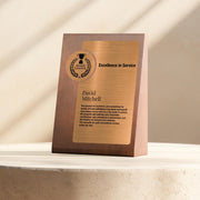 a plaque on a table with a window in the background