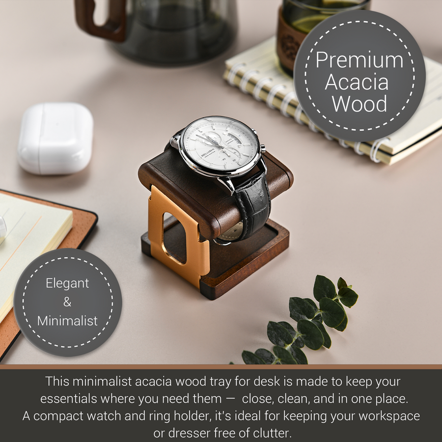a minimalist acacia wood desk tray that is designed to keep essential items like a watch and ring holder organized and easily accessible. The tray is made of wood and has a simple, functional design. It is placed on a desk, with a book and a mug visible in the background. The image also includes text that describes the tray as a "Premium Acacia Wood" and a "Minimalist" design, suggesting that it is a stylish and practical addition to a workspace.