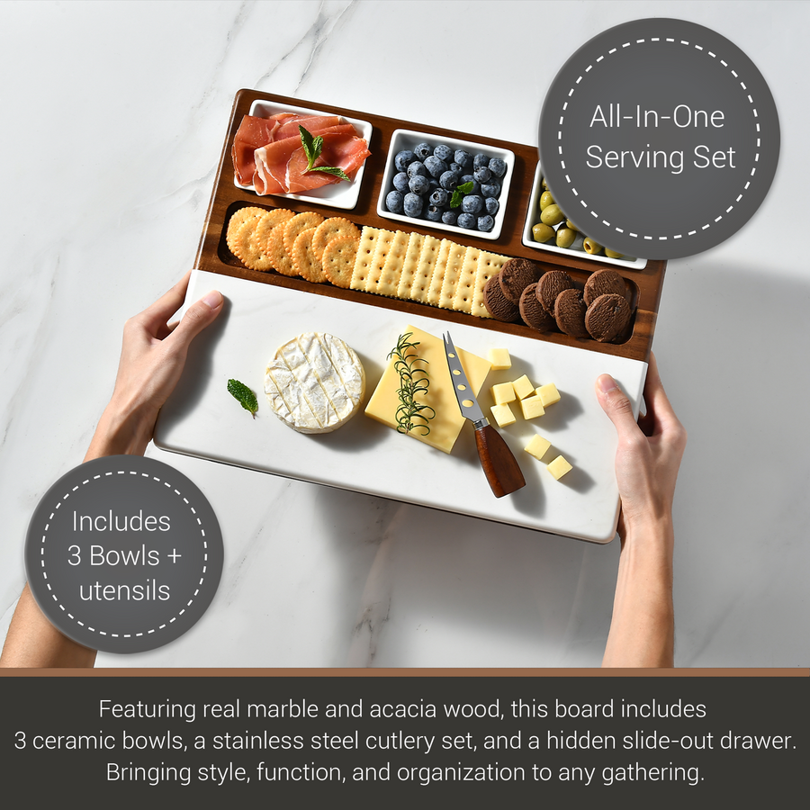 a wooden serving board with various food items, including crackers, cheese, fruit, and meats, arranged in three ceramic bowls. The board also includes a hidden drawer for additional serving tools.