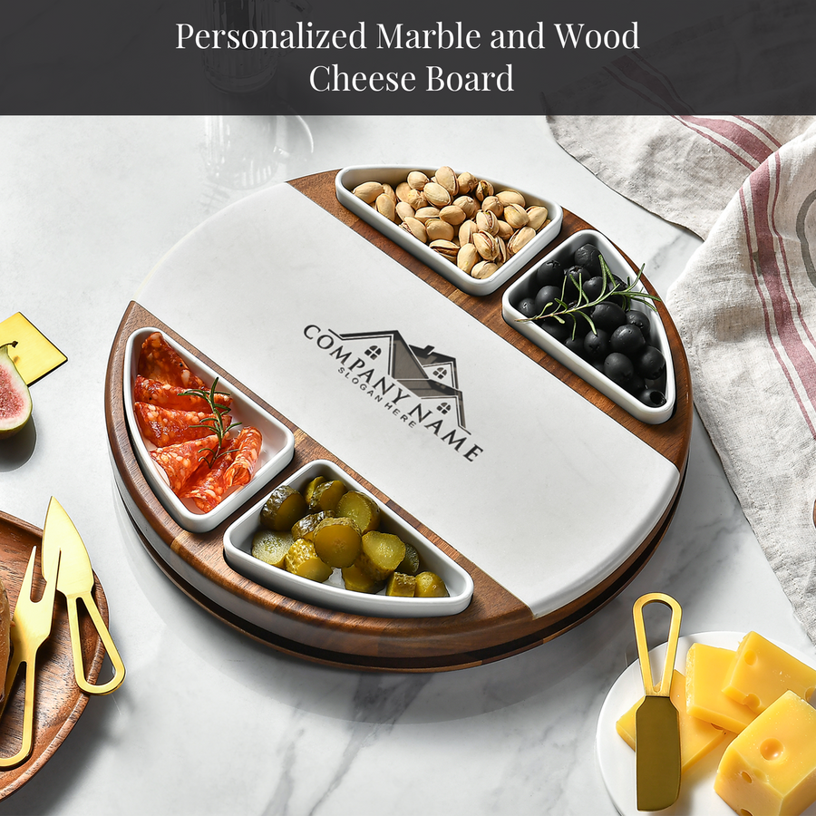 A round wooden cheese board with various food items, including cheese, crackers, nuts, olives, and pickles, arranged on a marble surface.