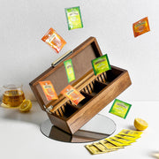 a wooden box filled with lots of different types of tea