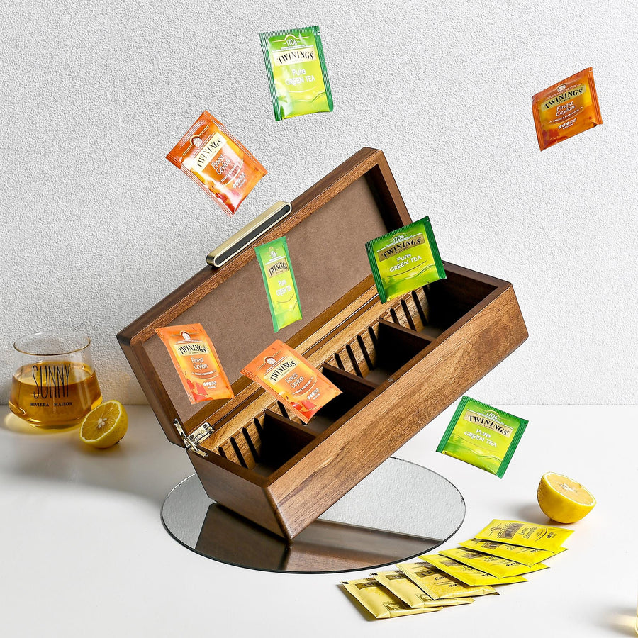 a wooden box filled with lots of different types of tea