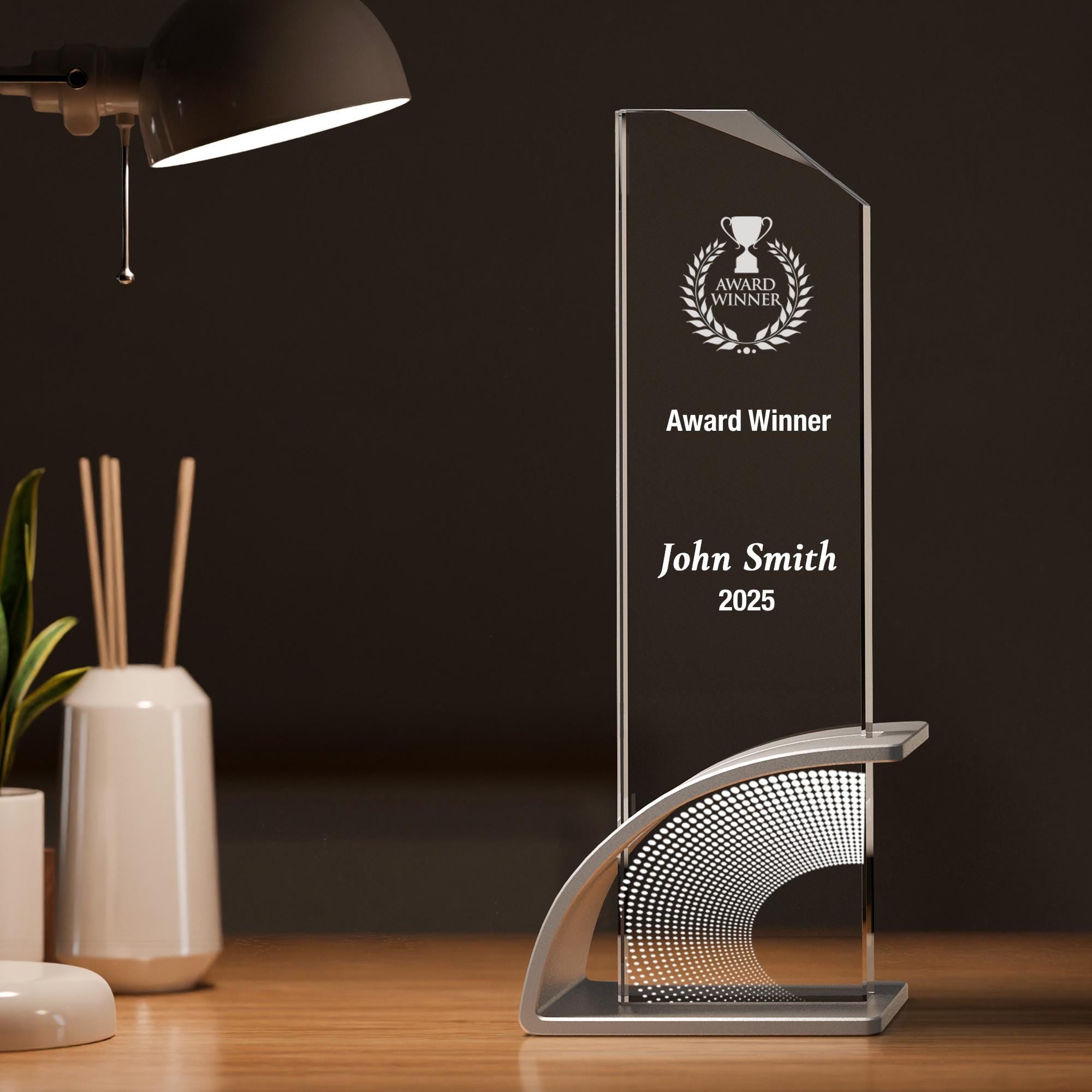 a glass award sitting on top of a wooden table