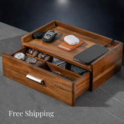 a wooden desk with a drawer and a phone