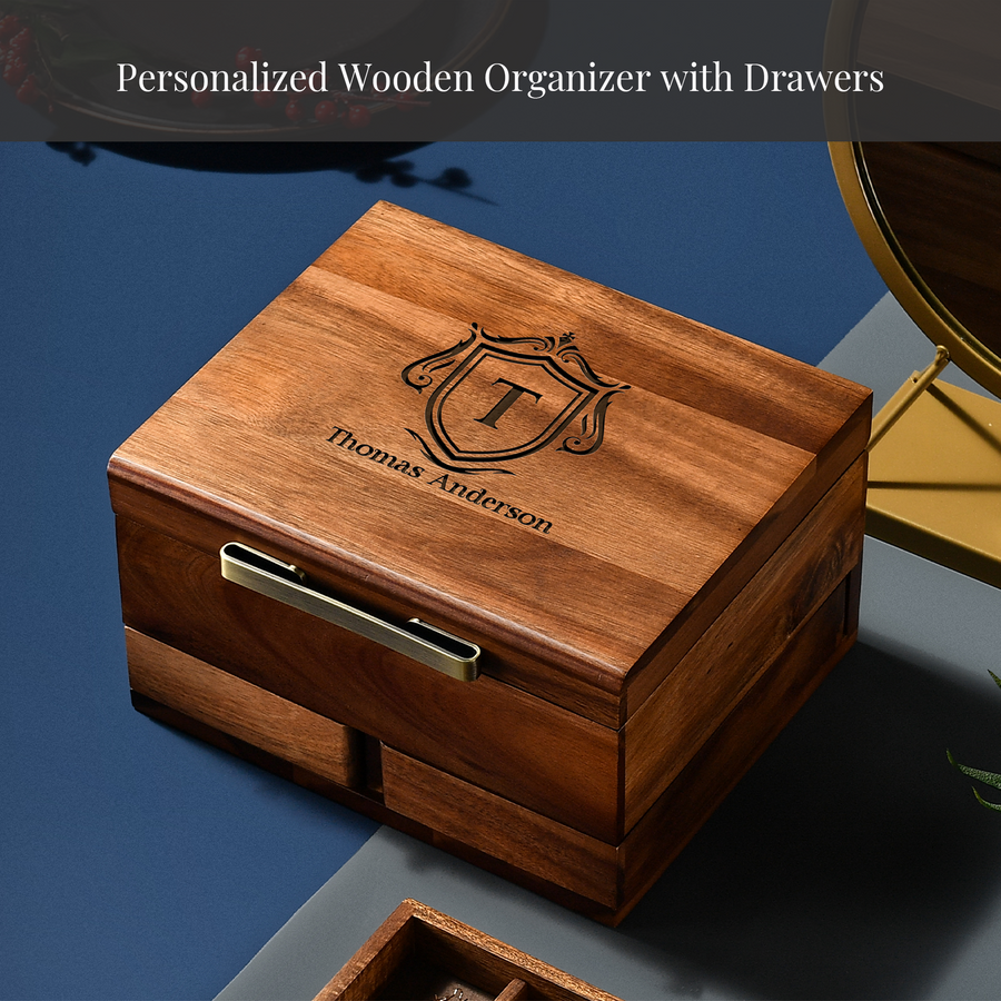 A wooden organizer with drawers, featuring a personalized design and the name "Thomas Anderson" engraved on it.