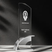 a glass award with a black background