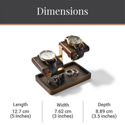 A wooden watch stand with two watches on it, along with some rings and a pen holder.