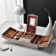 an open jewelry box sitting on top of a table