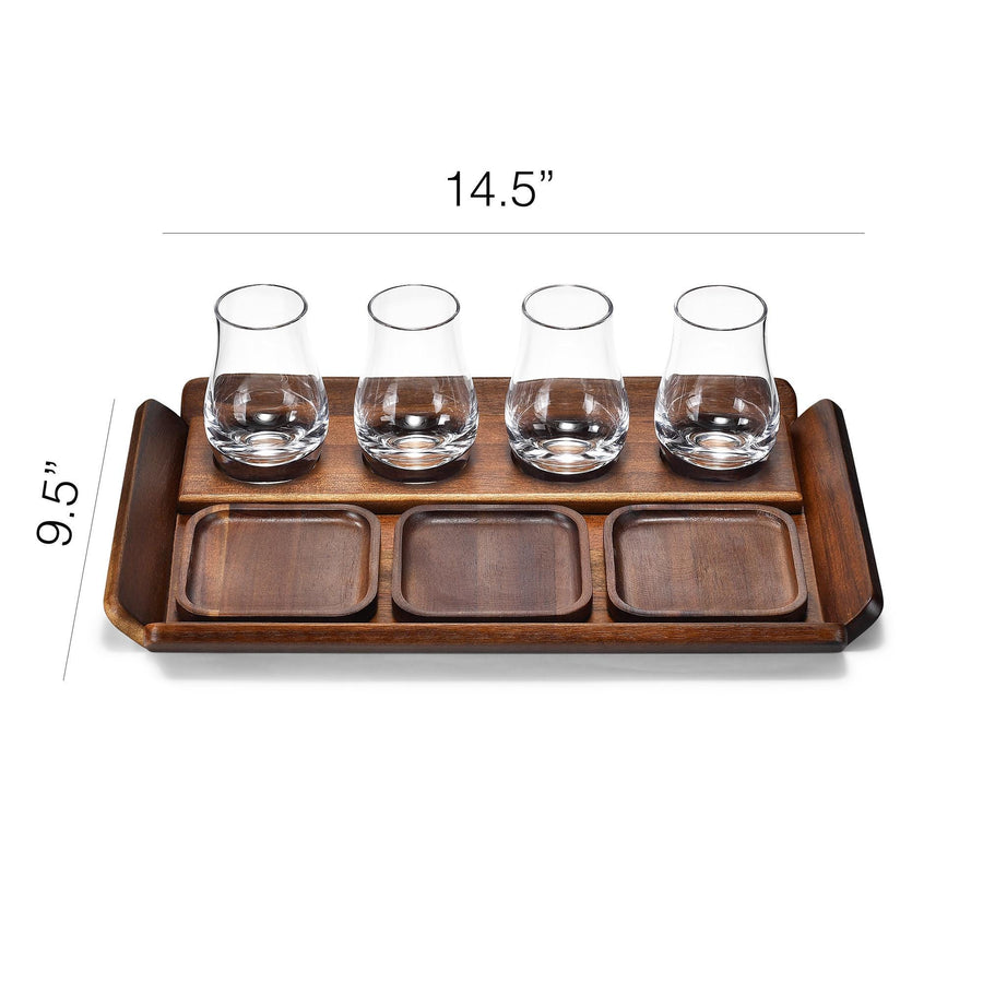 A wooden tray with four glasses on it, arranged in a row.