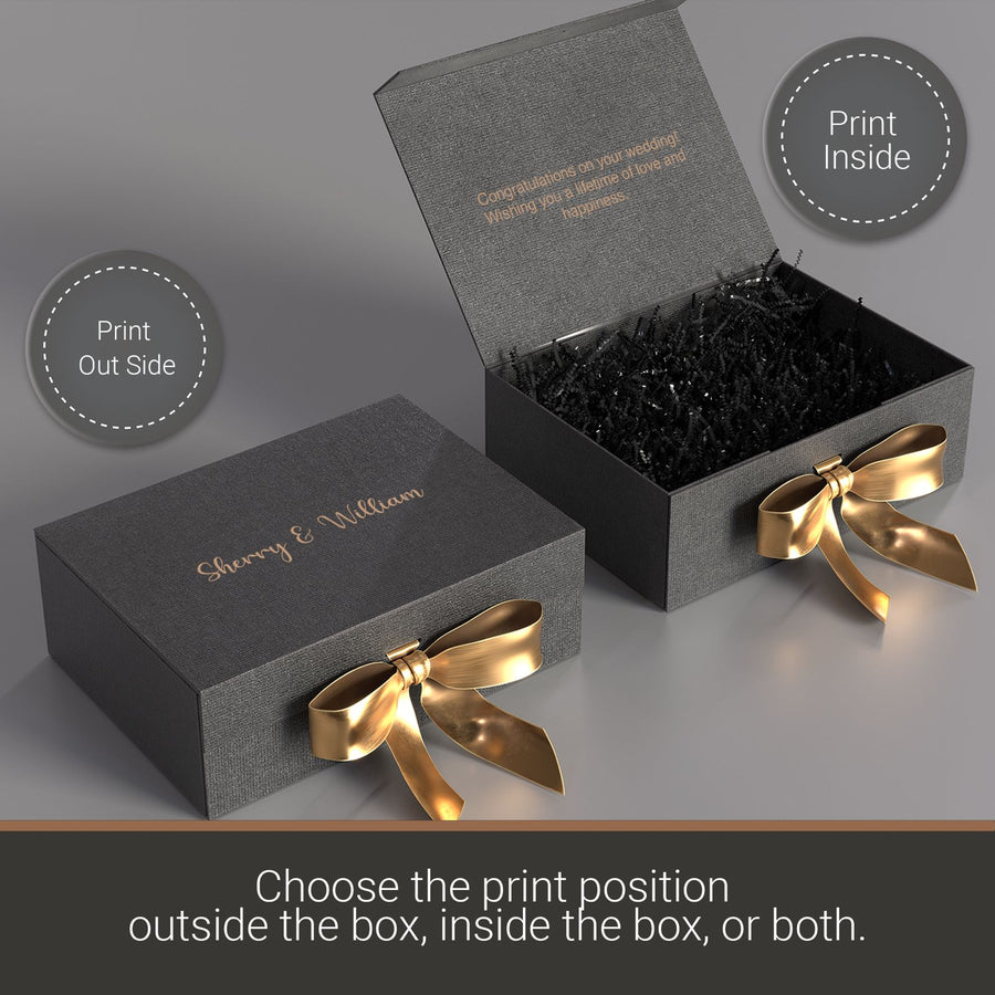 two gray gift boxes with gold bows, one open and one closed. The boxes are placed on a gray surface.
