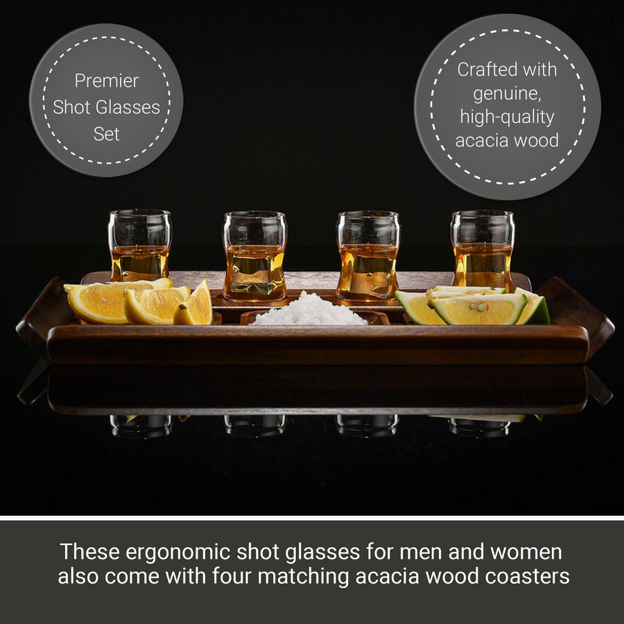 a set of four shot glasses, each with a matching acacia wood coaster, arranged on a wooden tray. The shot glasses are labeled as "Premier Shot Glasses Set" and "Crafted with genuine, high-quality acacia wood".