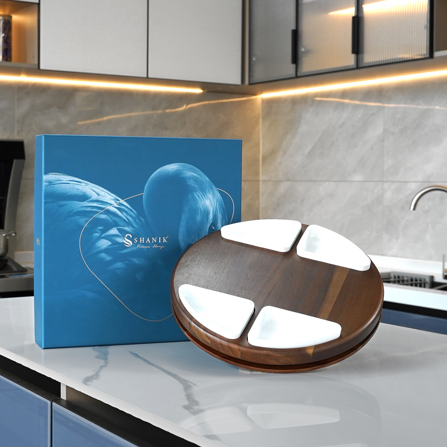 a wooden and white stand with a blue box with a picture of a bird on it, placed on a white countertop in a kitchen setting.
