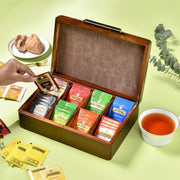 a wooden box filled with different types of tea