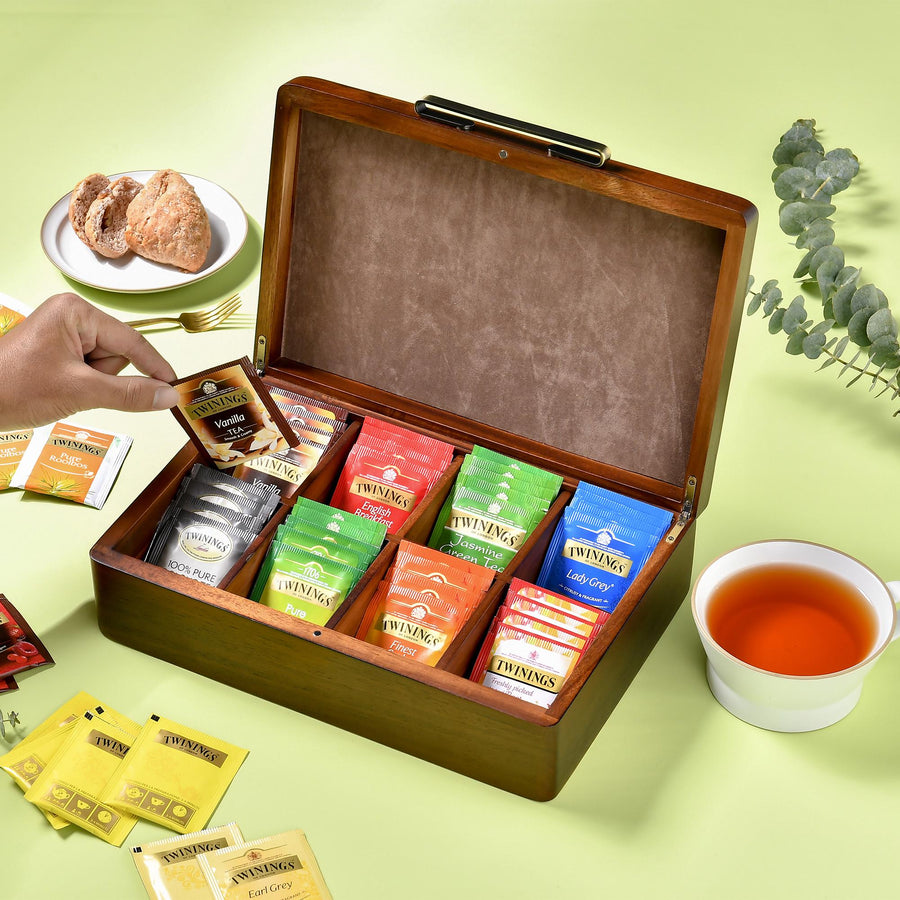 a wooden box filled with different types of tea