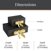two black boxes with gold bows, labeled with dimensions and descriptions.