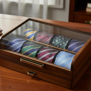 A wooden display case containing a collection of colorful neckties arranged neatly inside.