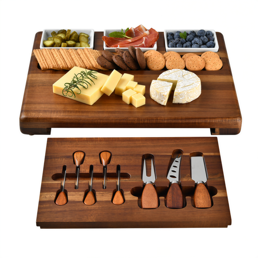 a wooden serving platter with various food items, including cheese, crackers, and fruit, as well as a set of wooden serving utensils.