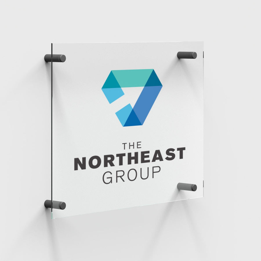 a sign for &quot;The Northeast Group&quot; with a logo featuring a blue triangle and the text &quot;The Northeast Group&quot; below it.