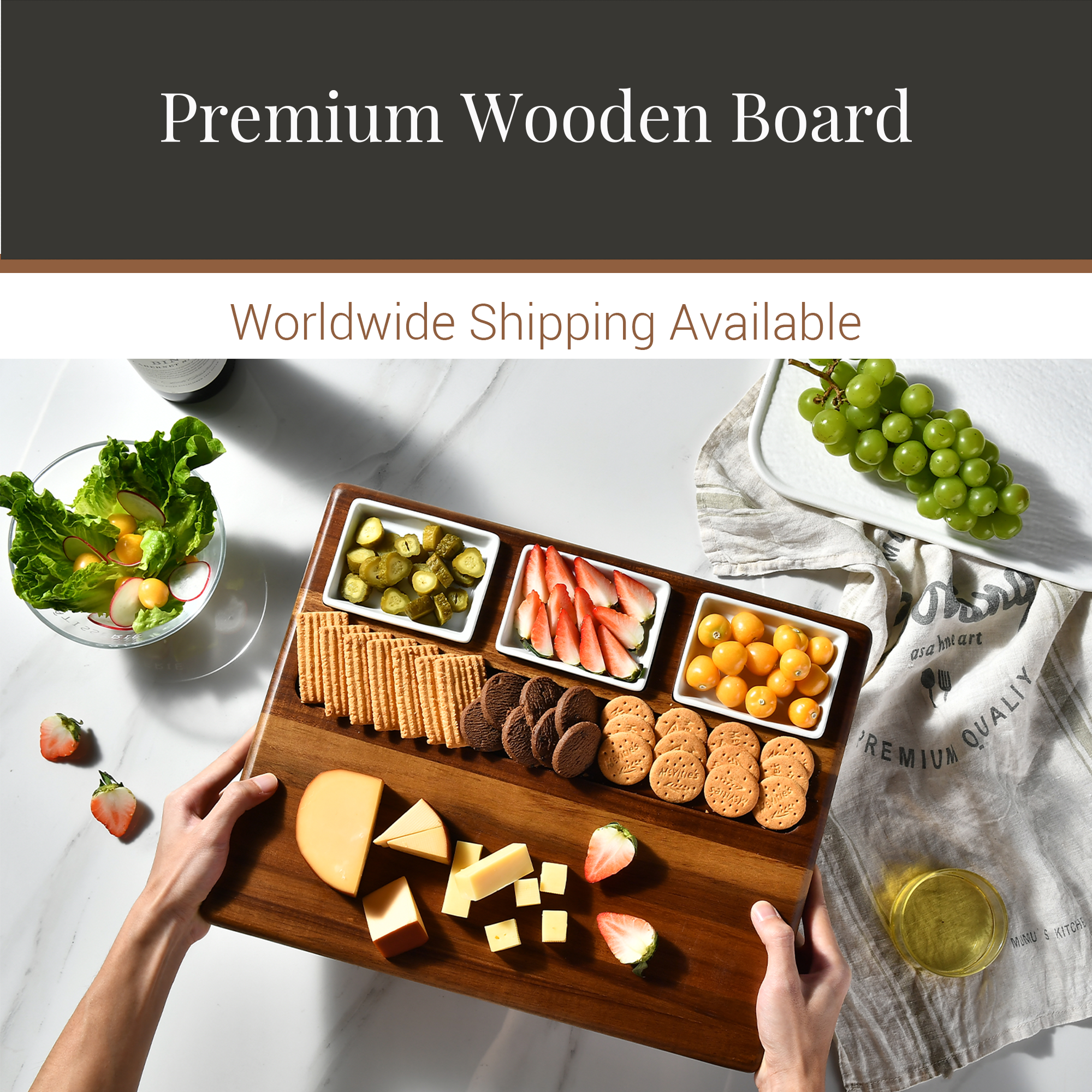 a wooden board filled with various food items, including cheese, crackers, grapes, and other snacks, being held by a person.