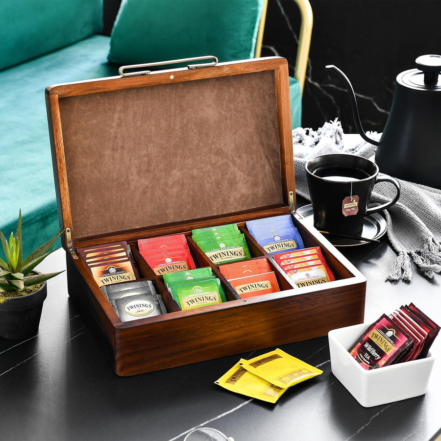 a wooden box filled with lots of different types of candy