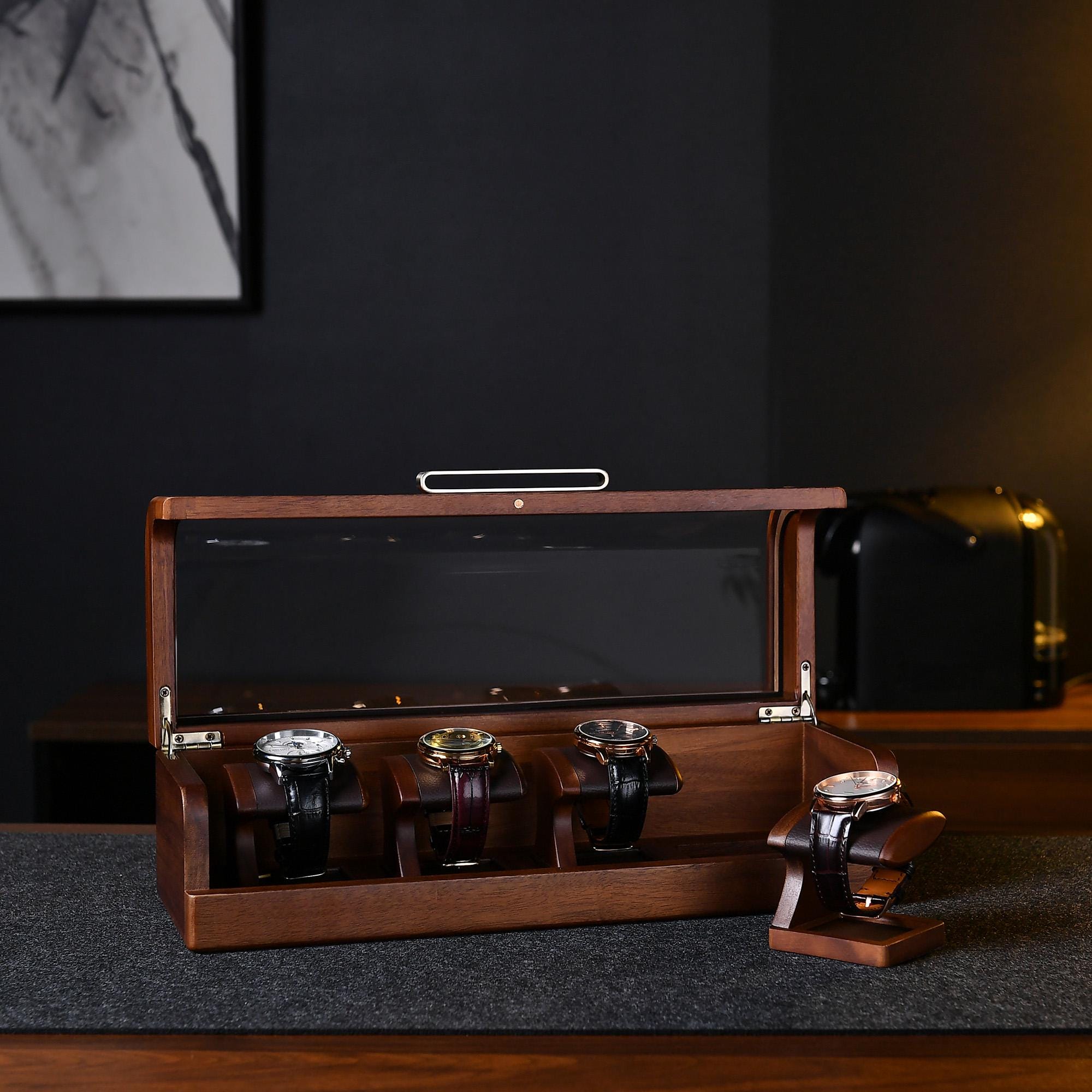 a wooden watch box sitting on top of a table