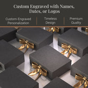 a collection of black gift boxes with gold bows, arranged in a visually appealing manner.