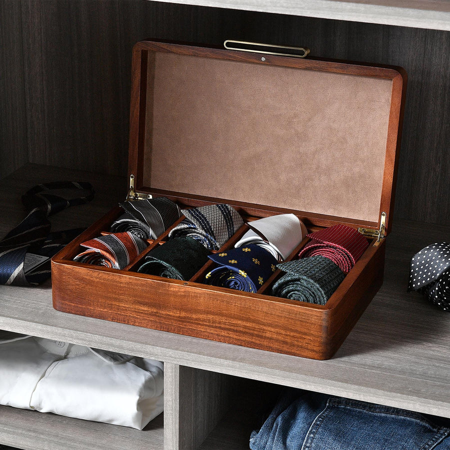 a wooden box filled with lots of ties