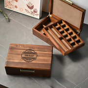 two wooden jewelry boxes, one with a carved name and the other with compartments. The name carved on the box is "Michael".