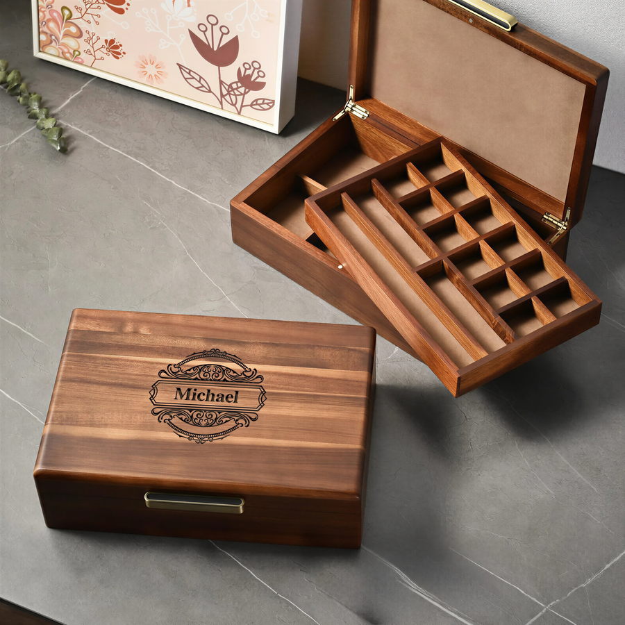 two wooden jewelry boxes, one with a carved name and the other with compartments. The name carved on the box is "Michael".