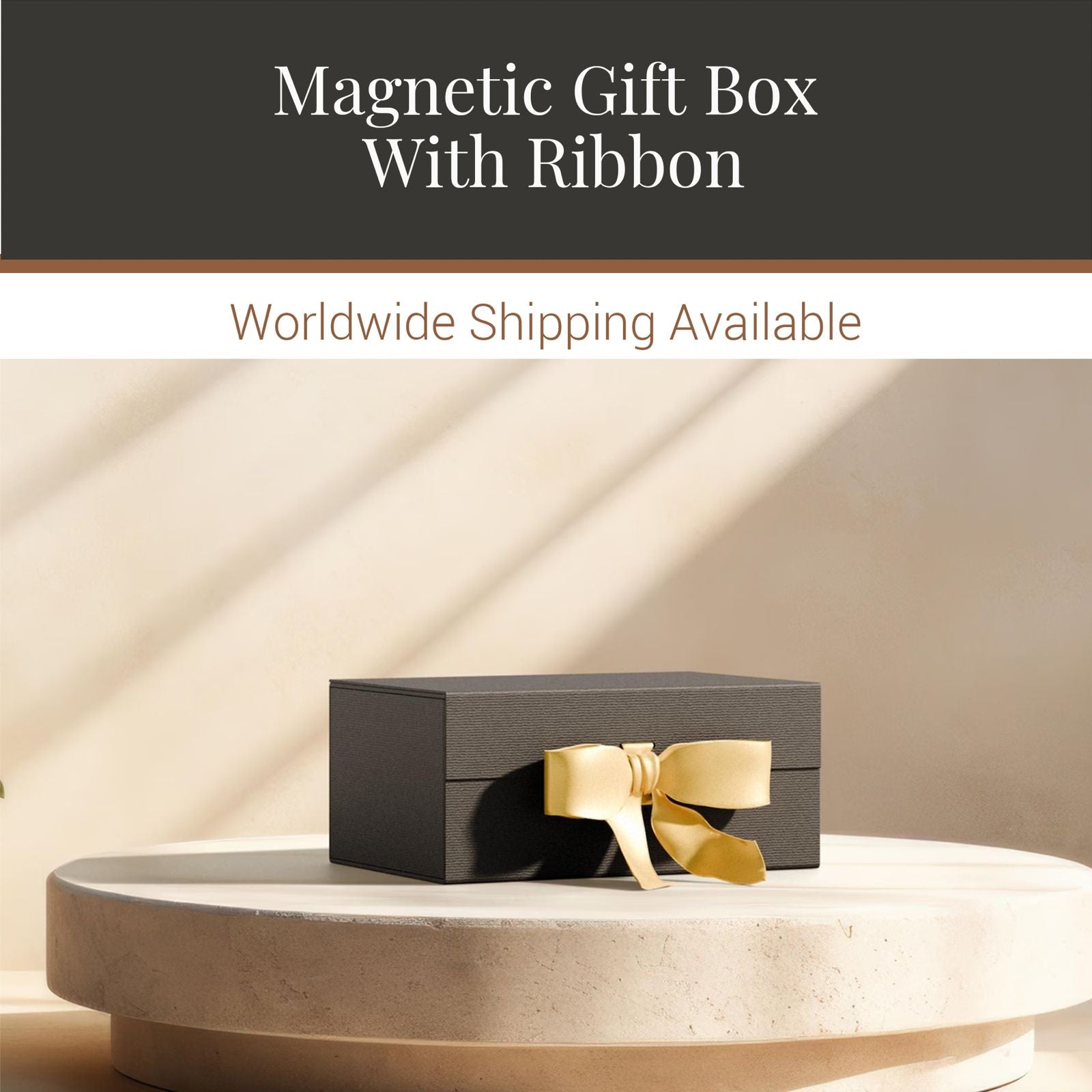 a black gift box with a gold ribbon, placed on a white pedestal.